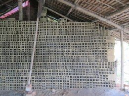 Freshly made bricks drying before firing in the kiln. They will shrink during firing.