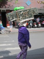 Just as in medieval days, street traders sold anything and everything. Here, it's birds.